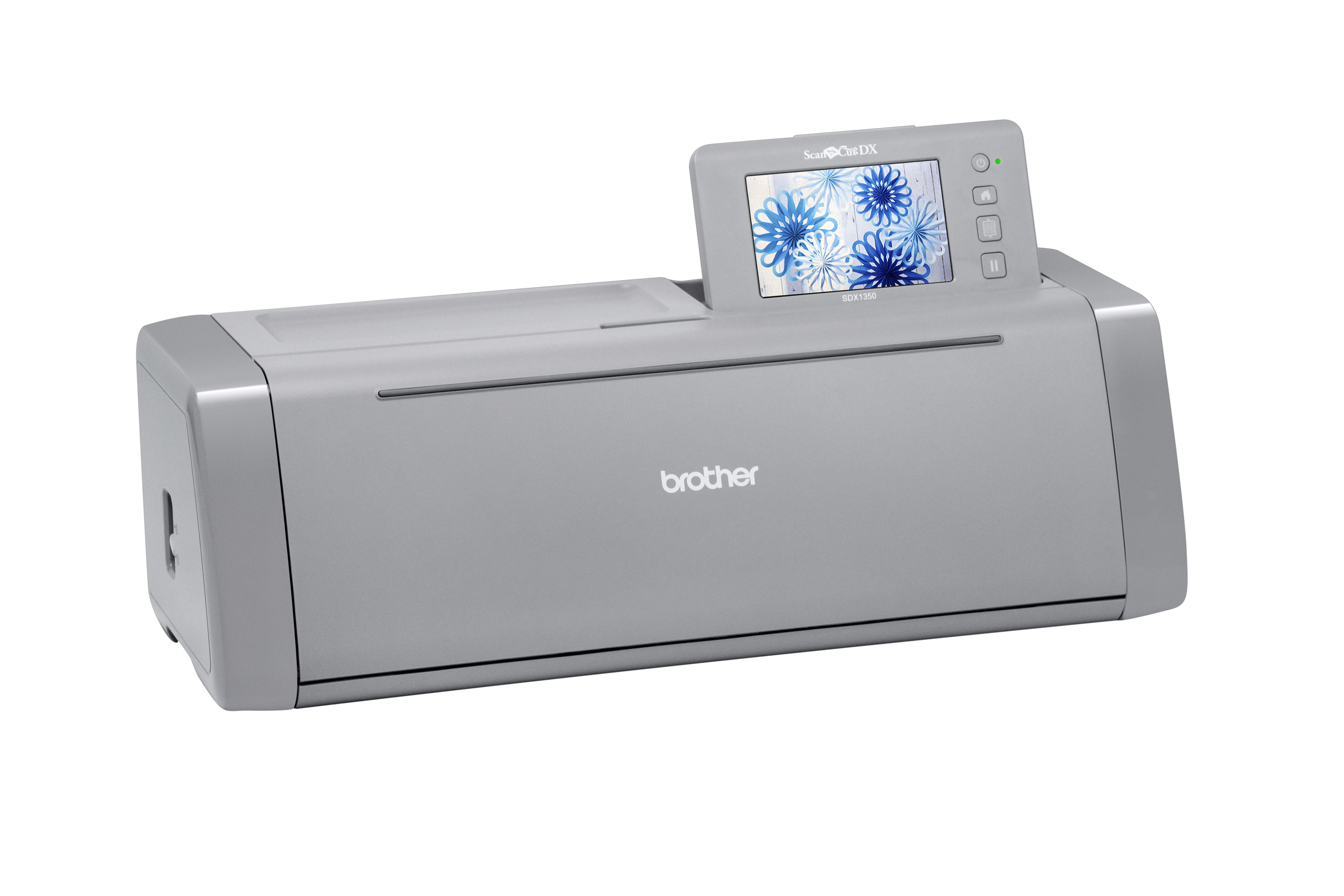 Graue Brother ScanNCut DX-Maschine mit Bildschirm, der blaue Blumendesigns zeigt.