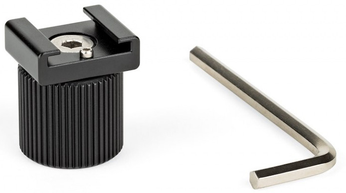 A black cold shoe adapter with a screw and an Allen wrench on a white background.