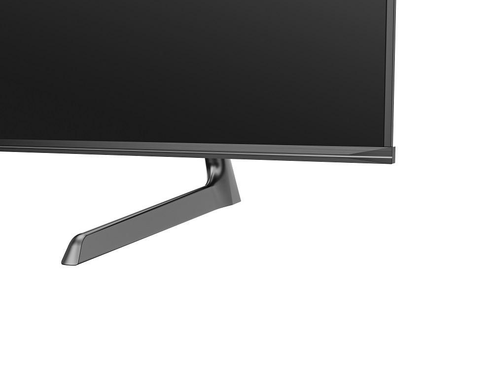 TV-Ständer. Der Ständer ist dunkelgrau und die Basis des Fernsehers ist sichtbar.