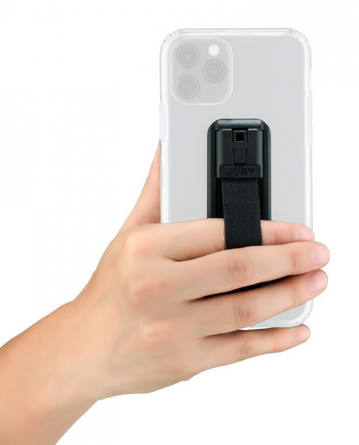A person's hand holding a phone with a black phone grip. The grip has a strap, and the phone is clear.