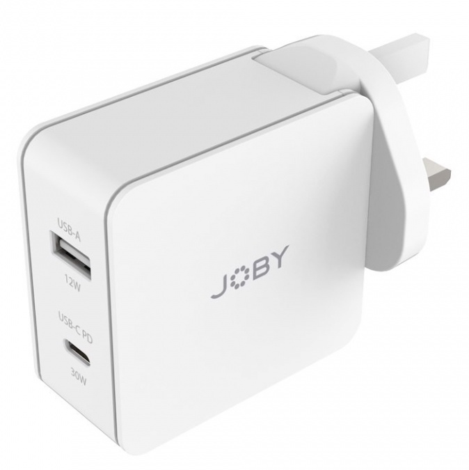 A white Joby charger with USB-A and USB-C ports. It has a UK plug.