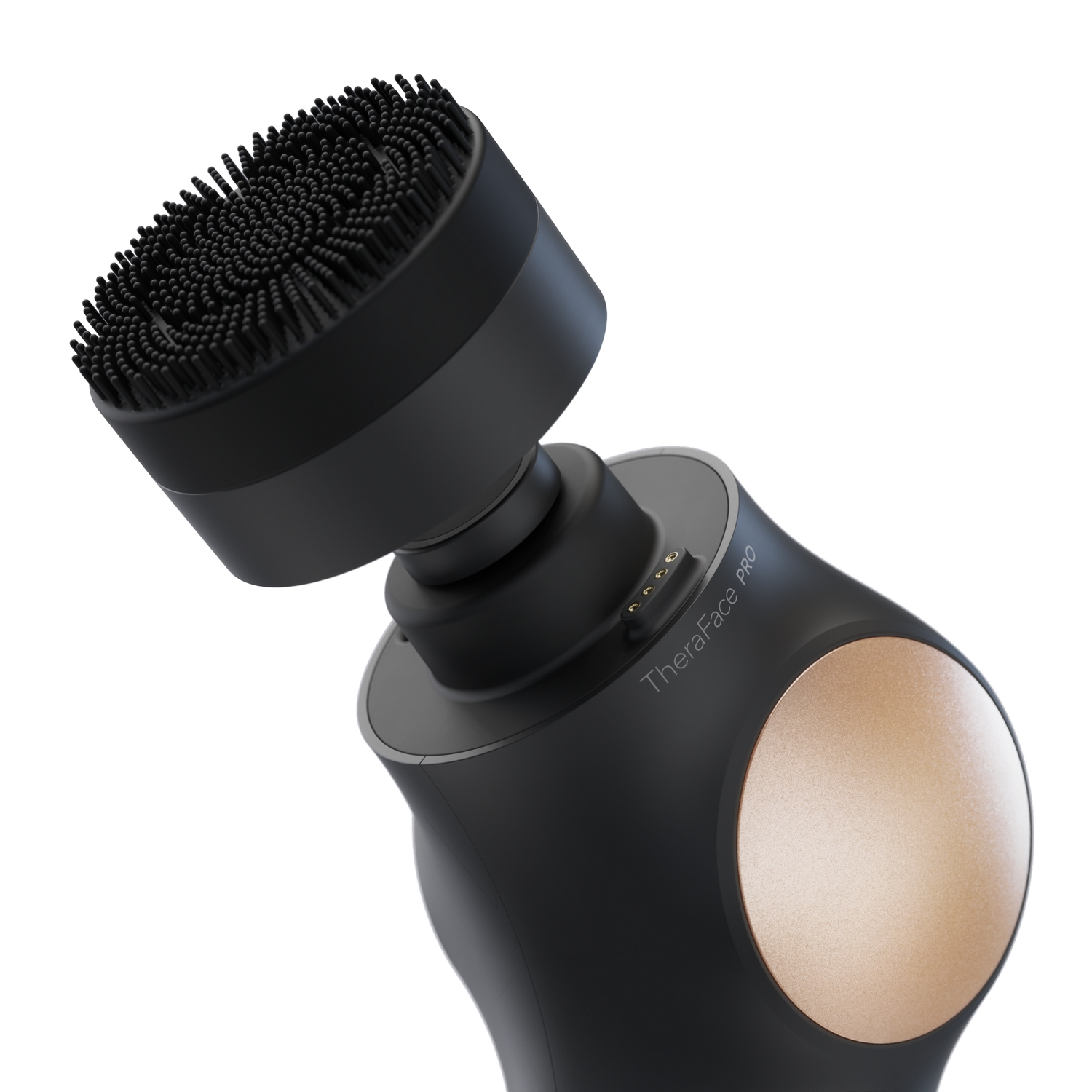 Un cepillo de limpieza facial negro con una cabeza redondeada y una base dorada.