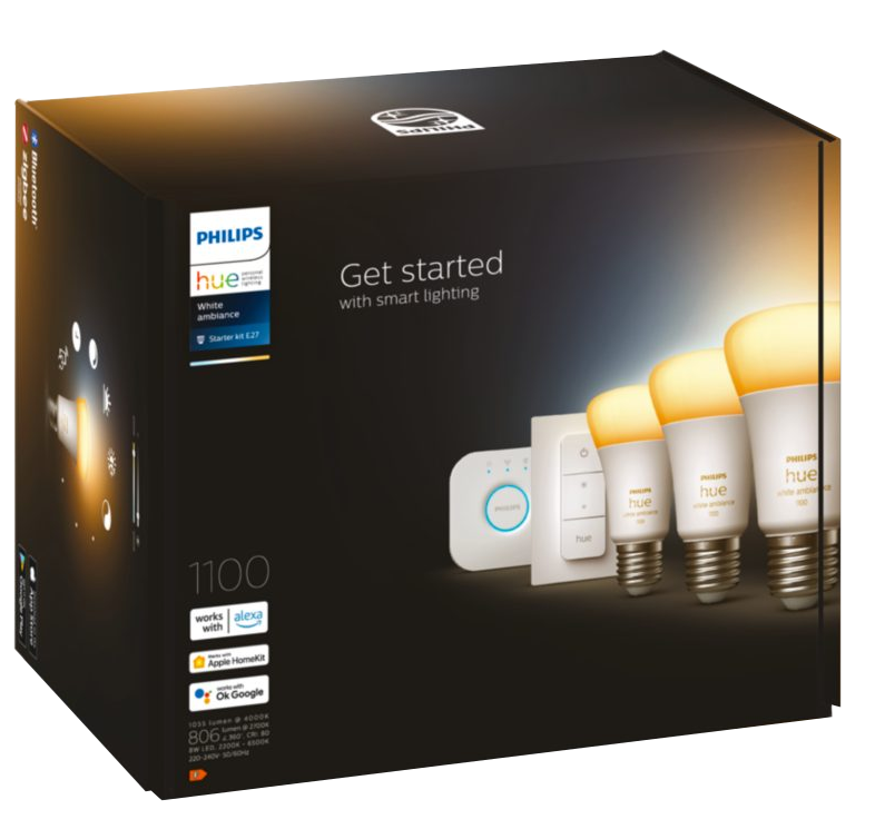 Philips Hue okos világítás doboz izzókkal, távirányítóval és hubbal sötét háttéren.