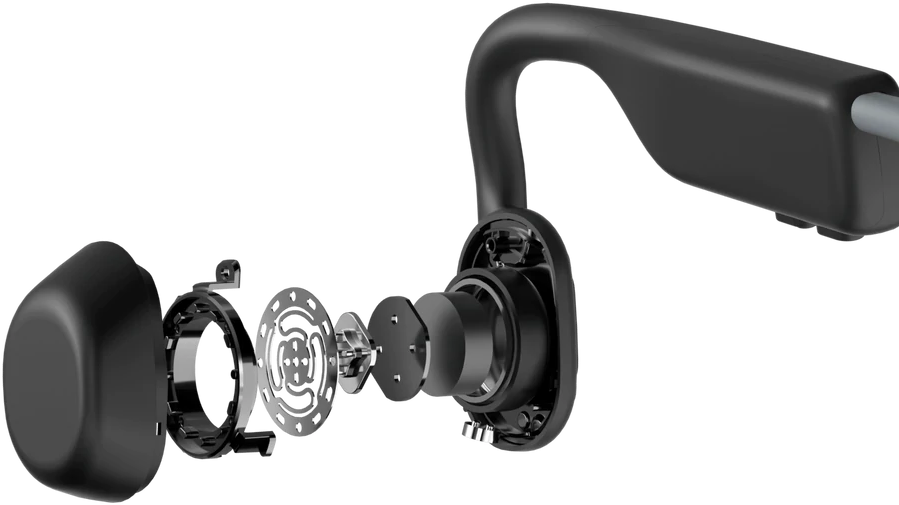 Vue éclatée d'un casque à conduction osseuse noir. Composants internes, fils et haut-parleur.