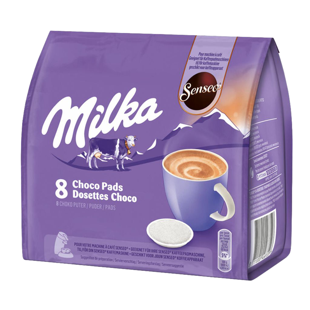 Egy csomag Milka Choco Pads egy csésze kávéval és egy párnával, fekete háttéren.
