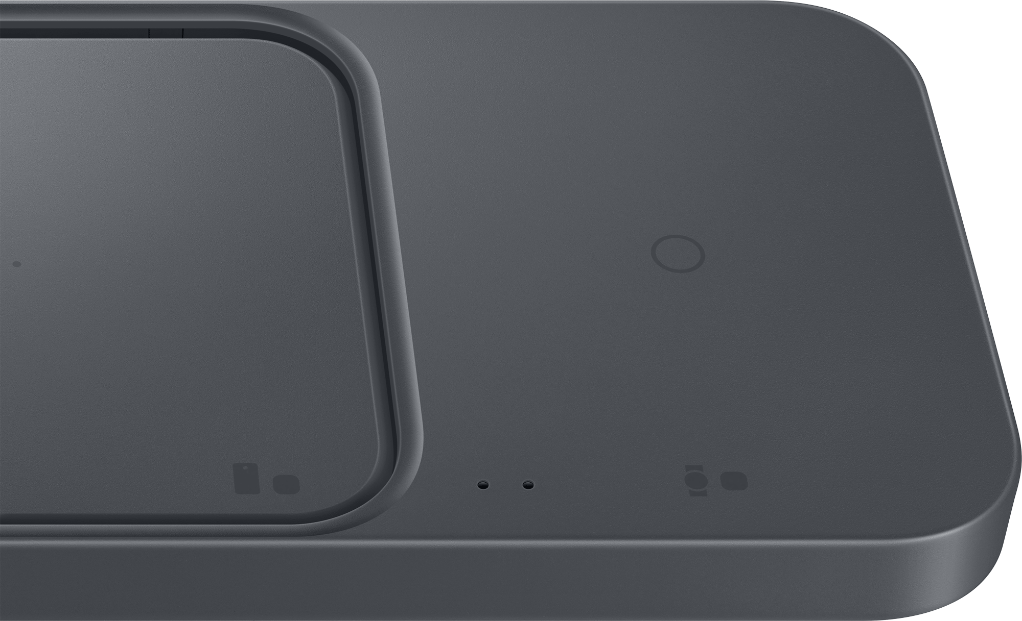 A dark gray wireless charging pad with two charging areas.