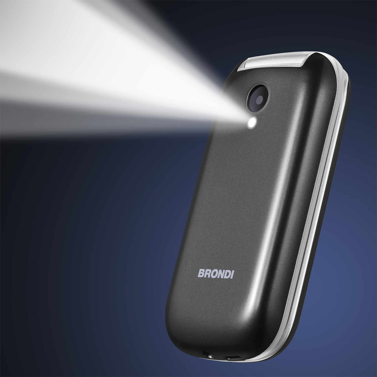 Un telefono a conchiglia nero con una luce intensa che brilla dalla fotocamera.