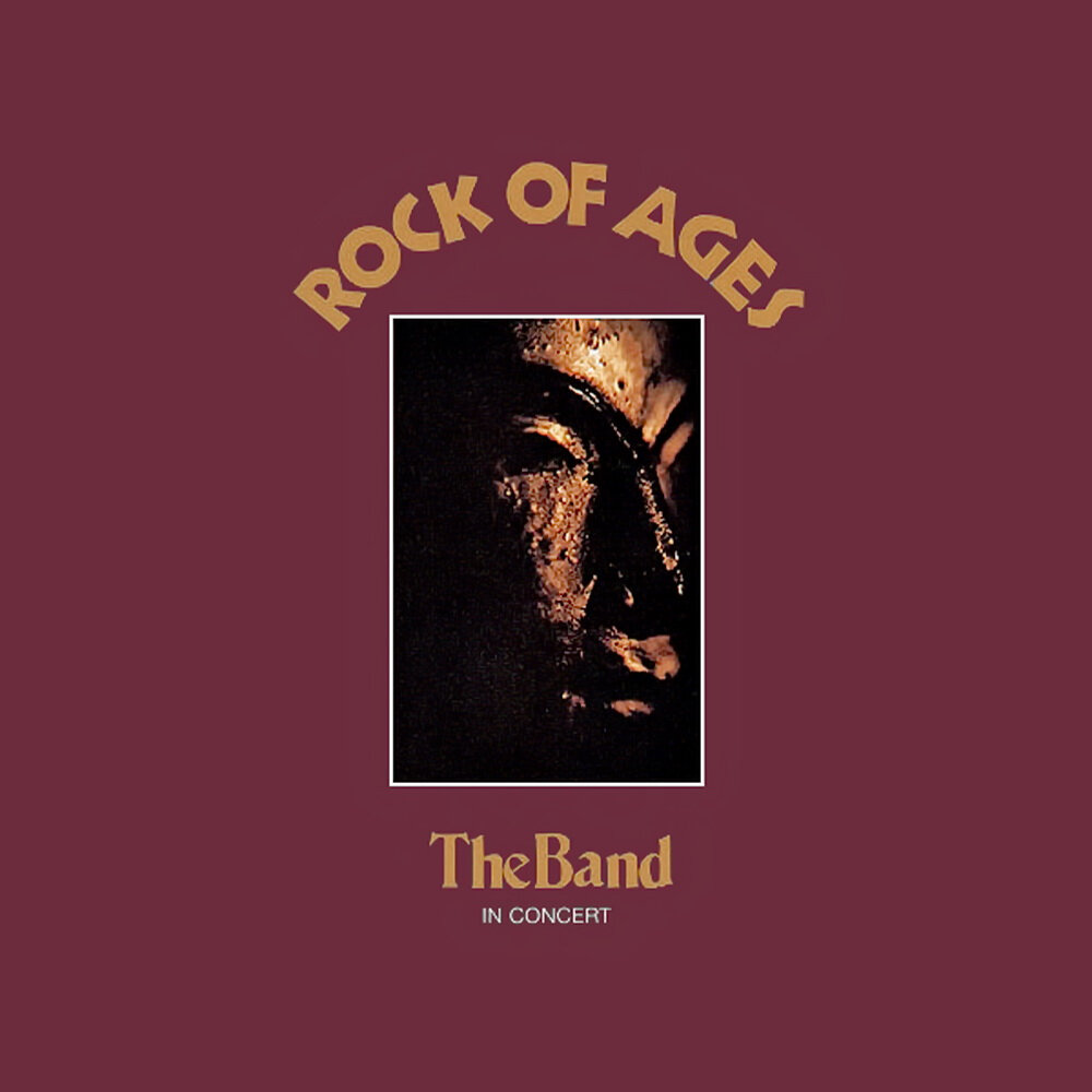 Album borító egy arccal, sötétvörös háttérrel és a Rock of Ages szöveggel.