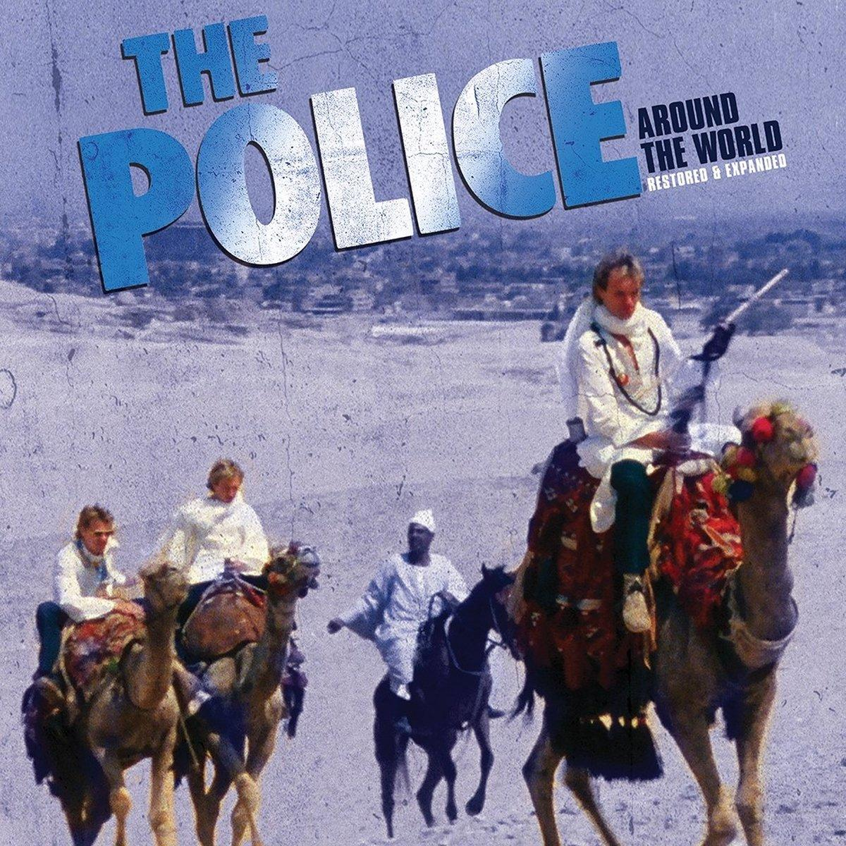 The Police album borító, emberek tevéken, sivatagi háttér.