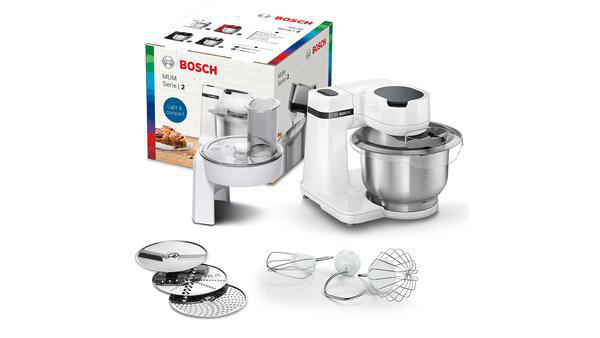 Eine weiße Bosch Küchenmaschine mit Karton und Zubehör.