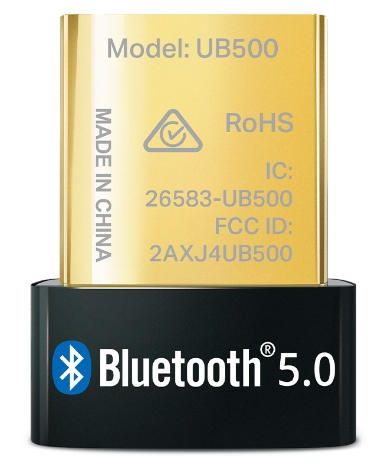 Small golden device with text and logo, on a black surface.