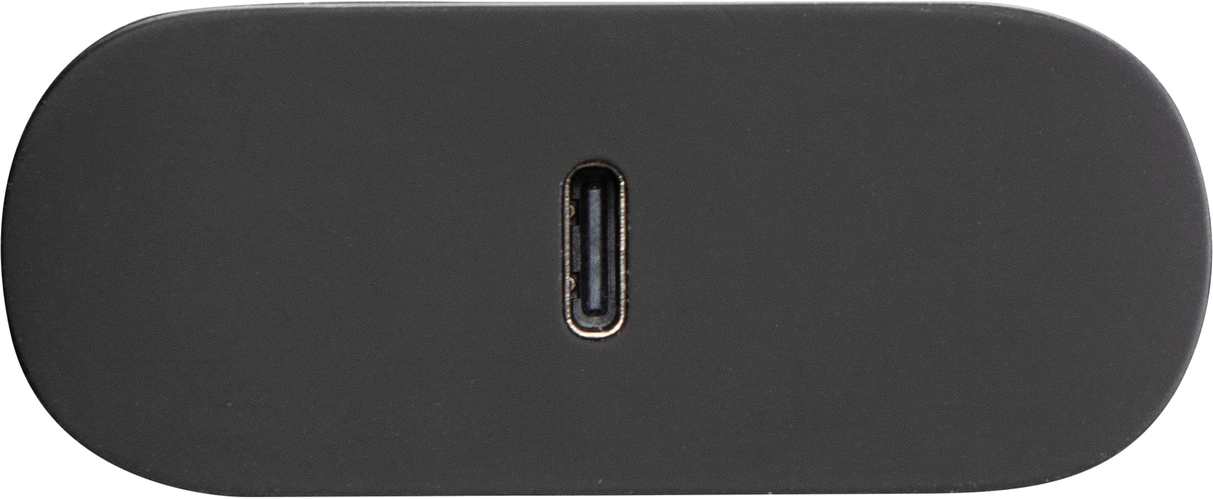Un appareil noir de forme ovale avec un port USB-C.