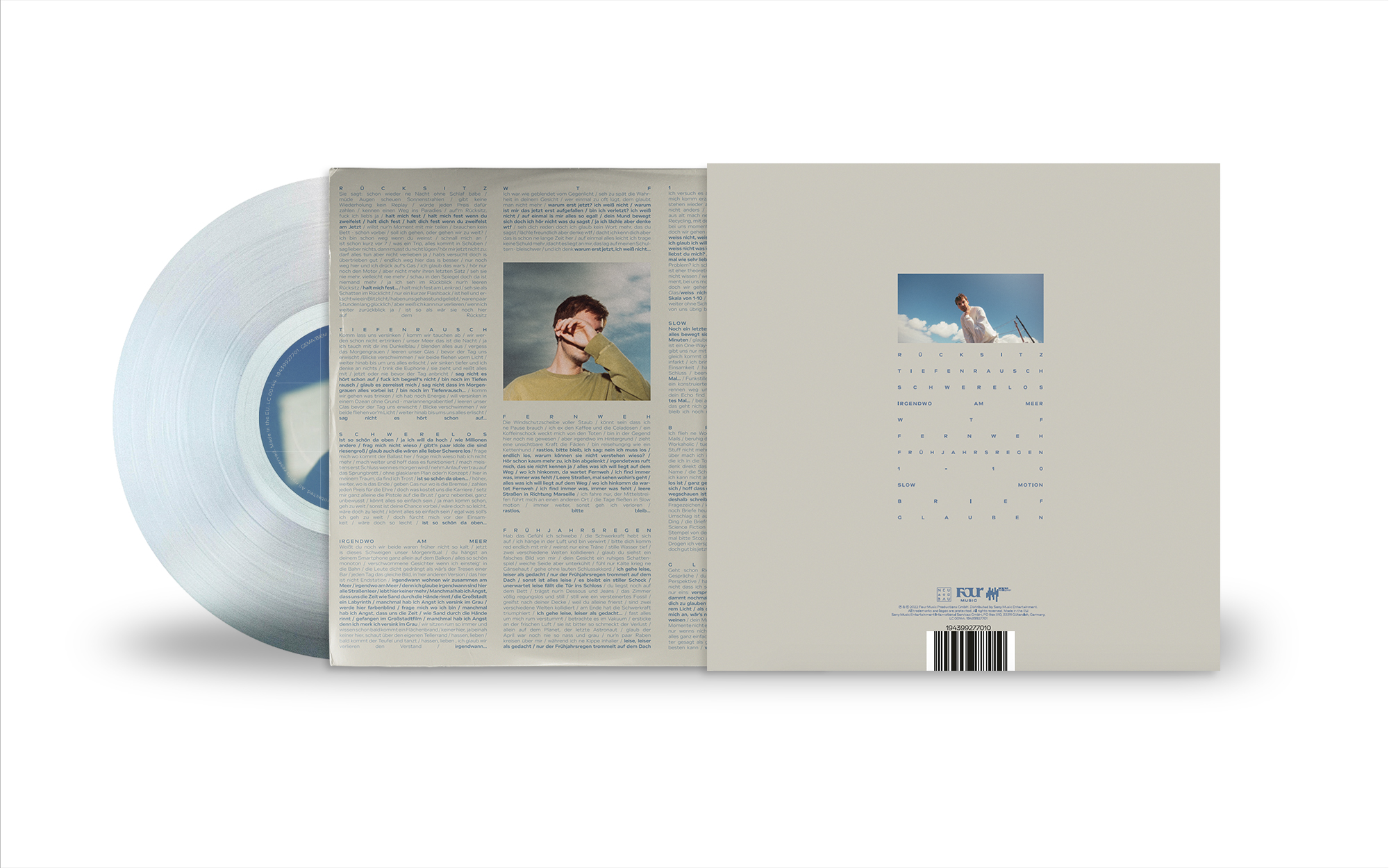 Vinylplatte mit Cover, das einen Mann, blauen Himmel und Text zeigt.