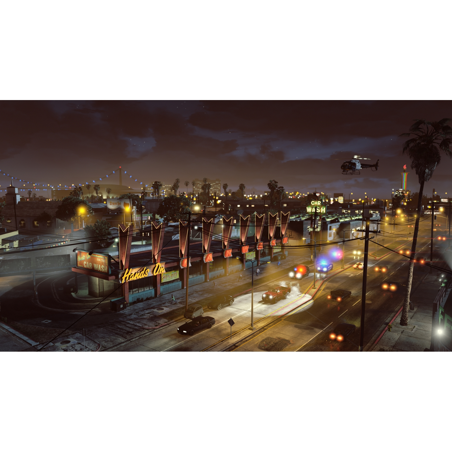Escena nocturna con un lavado de coches y un helicóptero.