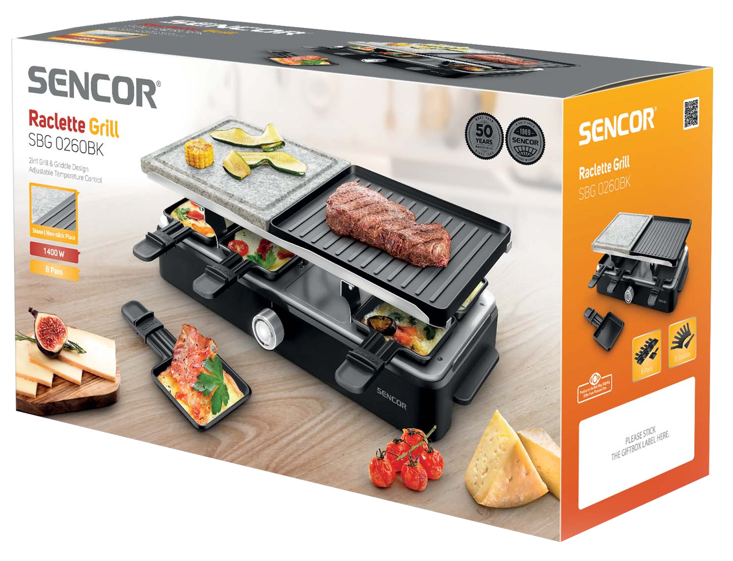 Raclette grill doboz grill-lel és serpenyőkkel. A doboz a terméket mutatja.