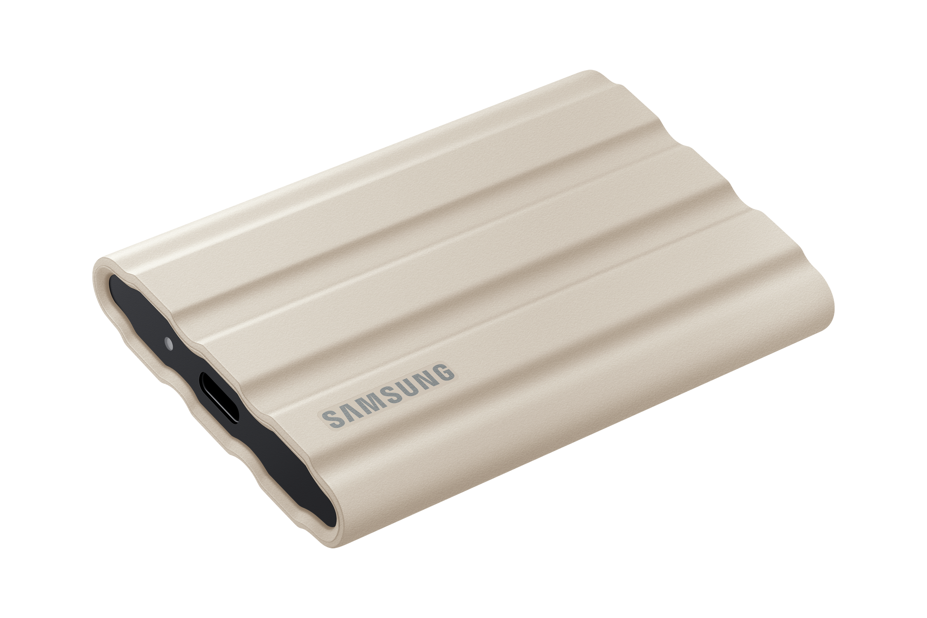 Tan-gekleurde Samsung externe harde schijf met een geribbeld ontwerp.