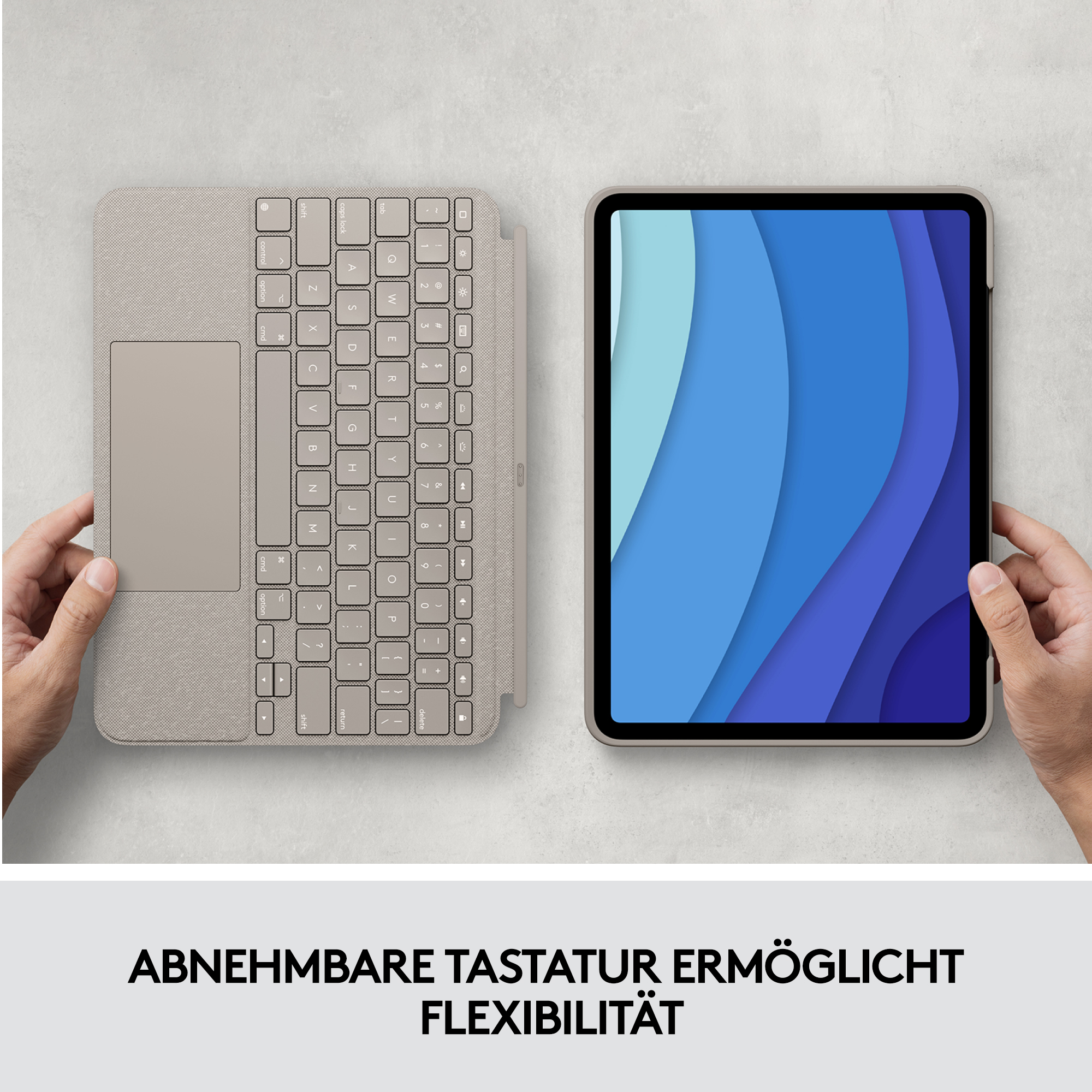Tablet mit Tastaturhülle, Grautöne, Hände halten sie.