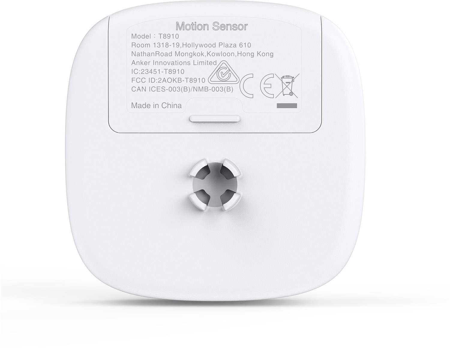 White motion sensor with text on the back. It has a circular connection point.