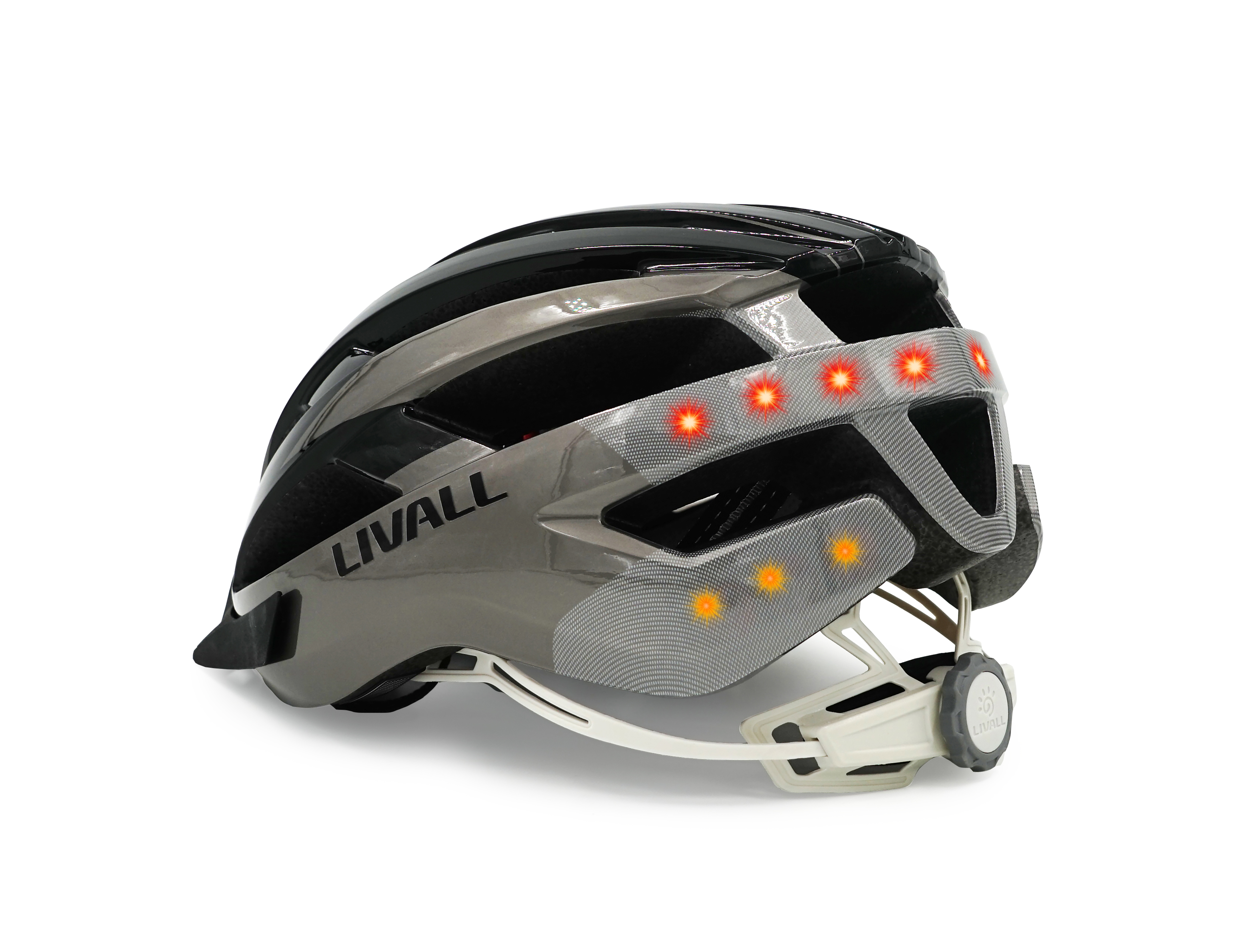 Ein schwarz-grauer Fahrradhelm mit roten und gelben Lichtern. Die Marke 'LIVALL' ist sichtbar.