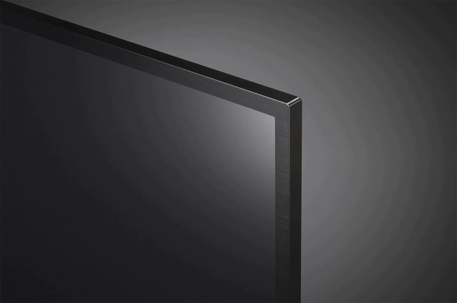A close-up of the corner of a black TV screen.
