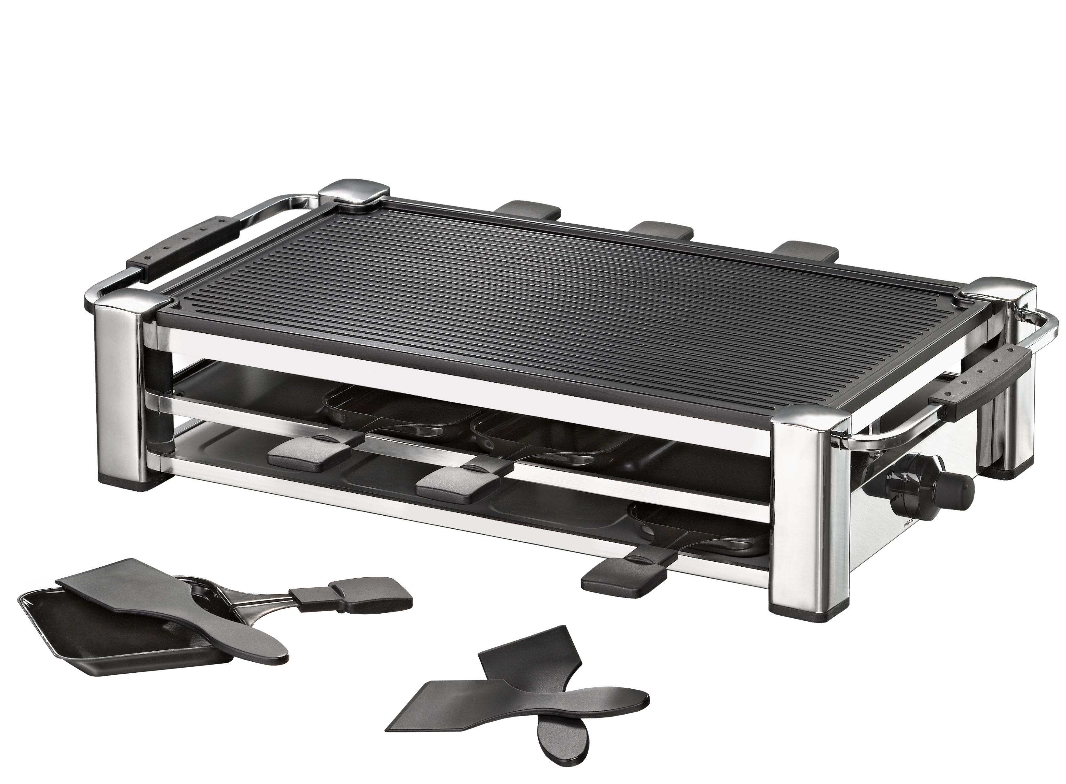 Raclette-Grill aus Edelstahl mit zwei Ebenen, schwarzen Grillplatten und Spateln. Weißer Hintergrund.