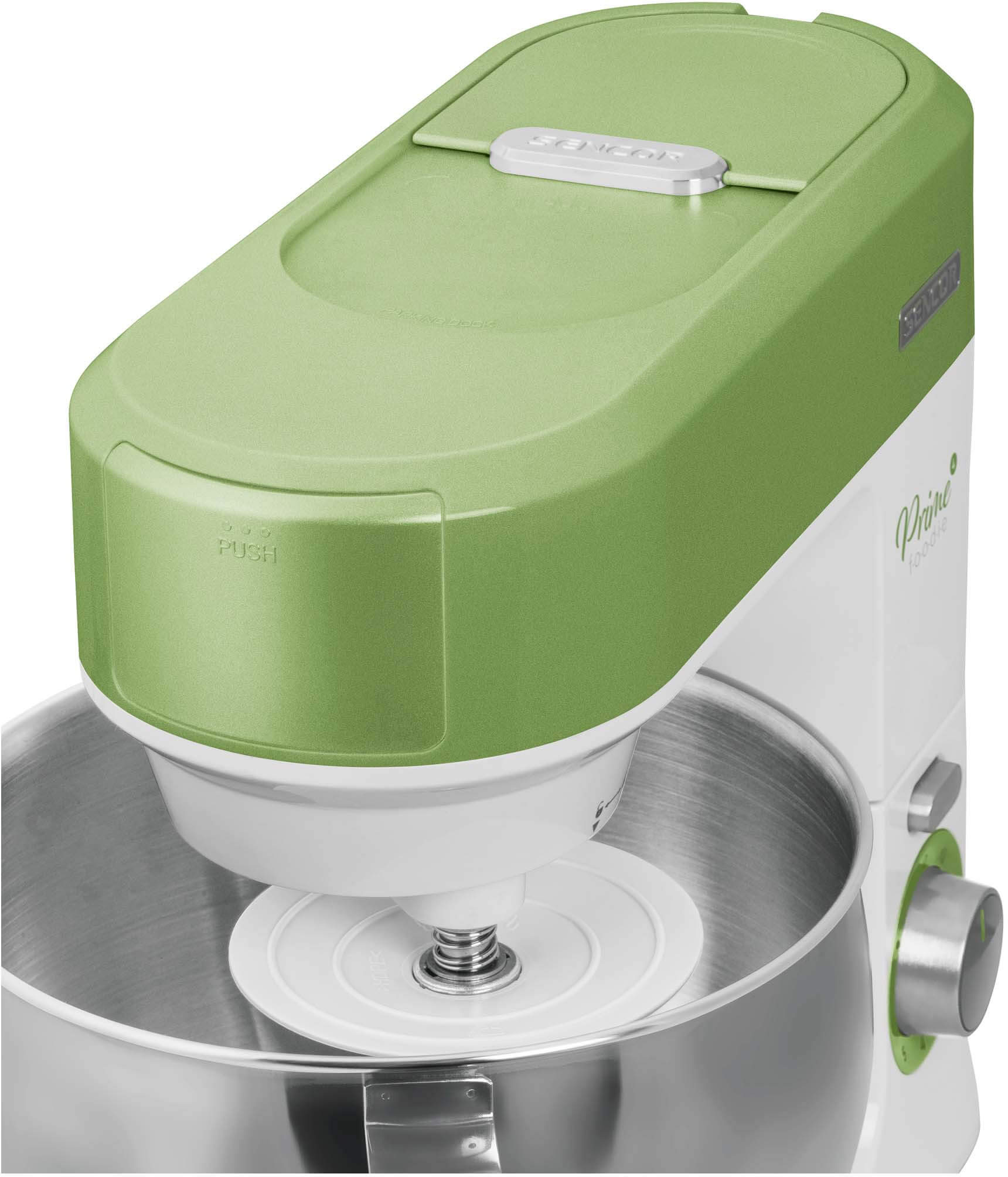 Zöld és fehér konyhai mixer fedéllel. A mixer fehér felületen van.