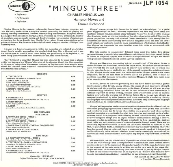 Ein Albumcover mit vier Männern in dunklen Anzügen.