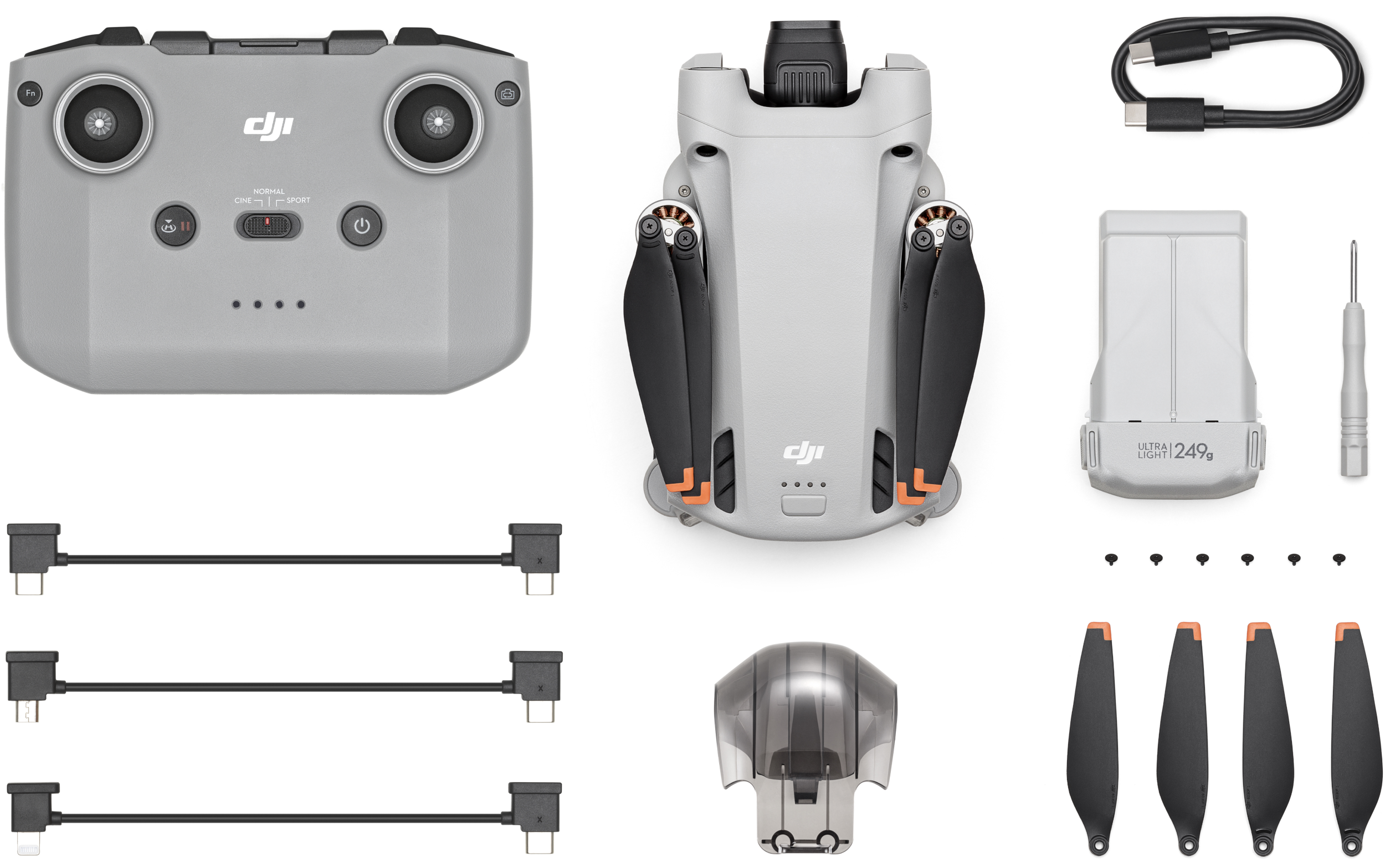 DJI Drohnen-Kit mit Drohne, Fernbedienung, Propellern, Akku, Ladegerät und Zubehör auf weißem Hintergrund.