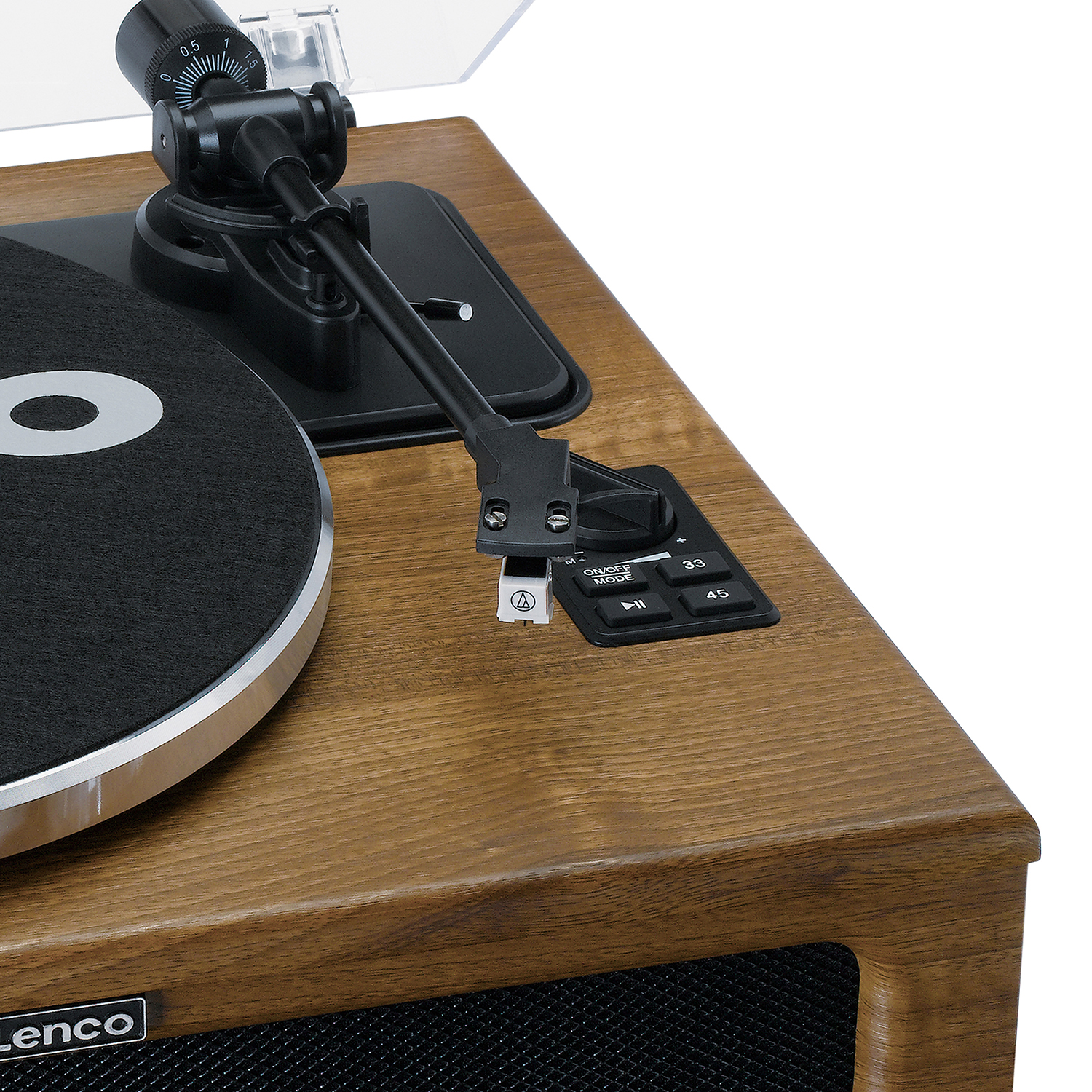 Close-up of a vintage turntable. Wooden finish, black platter, and control panel with buttons.