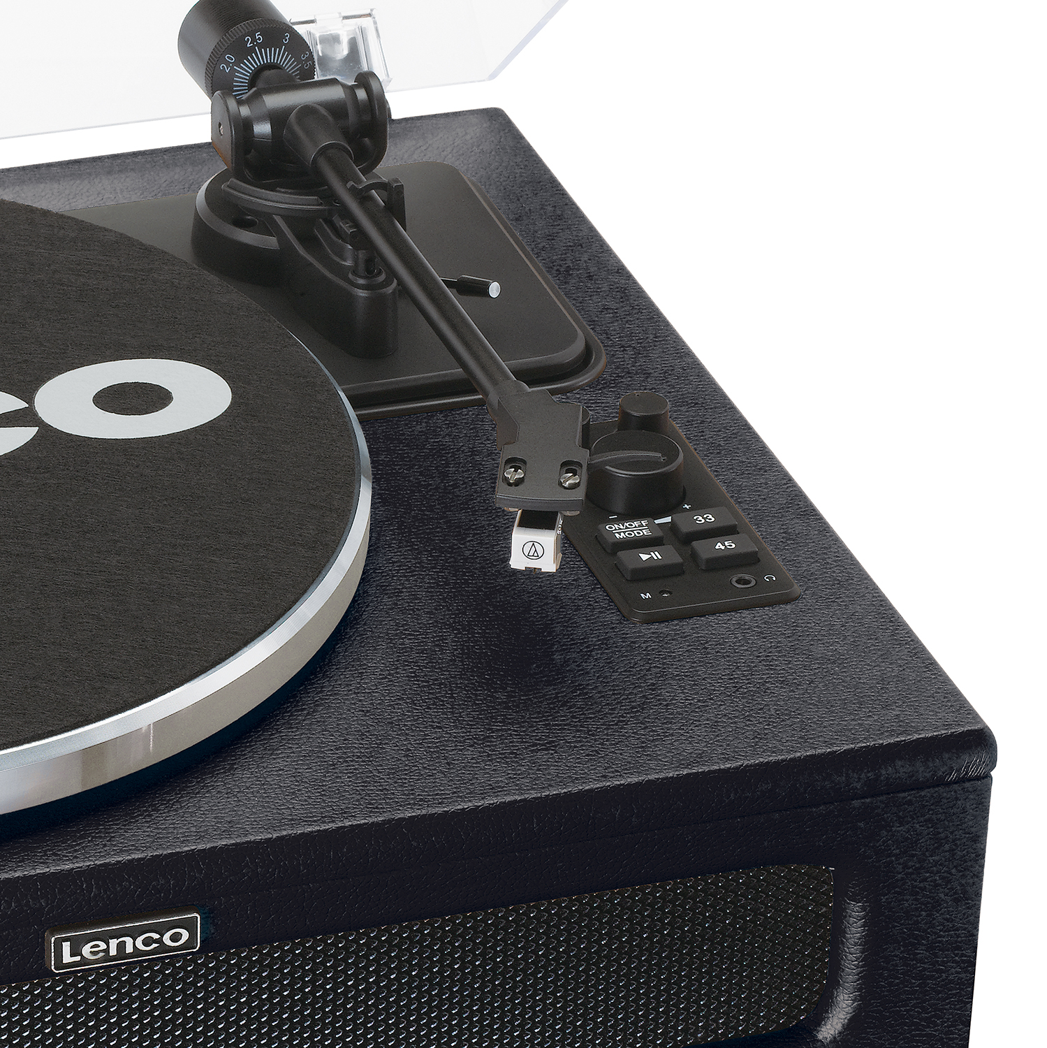 Close-up of a black turntable with a black record and silver rim.
