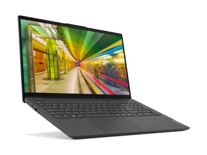 Ordenador portátil que muestra una escena de túnel de metro, inclinado con teclado oscuro sobre fondo negro.