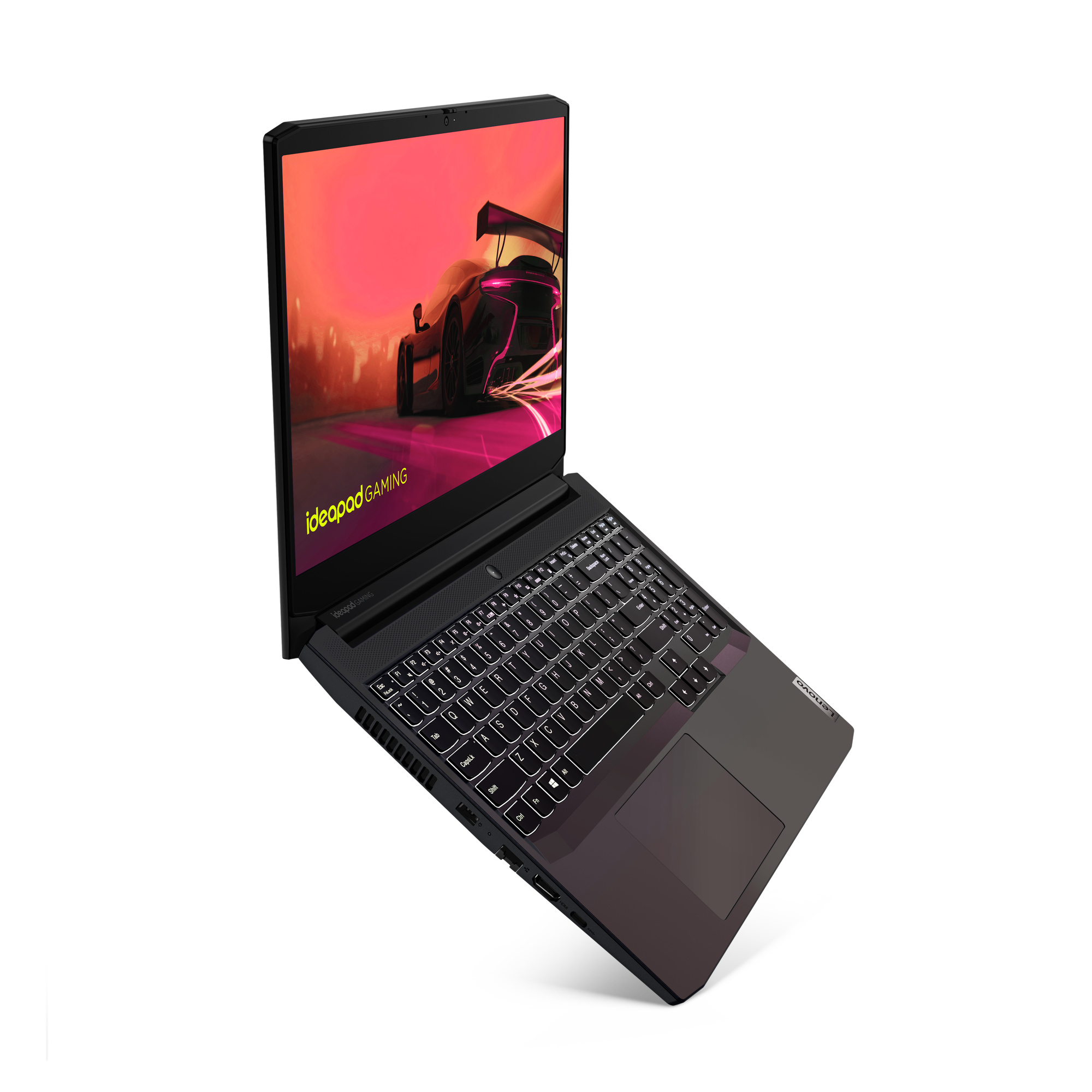 Un portátil negro con teclado brillante. La pantalla muestra una escena de juego de carreras en rojo y negro.
