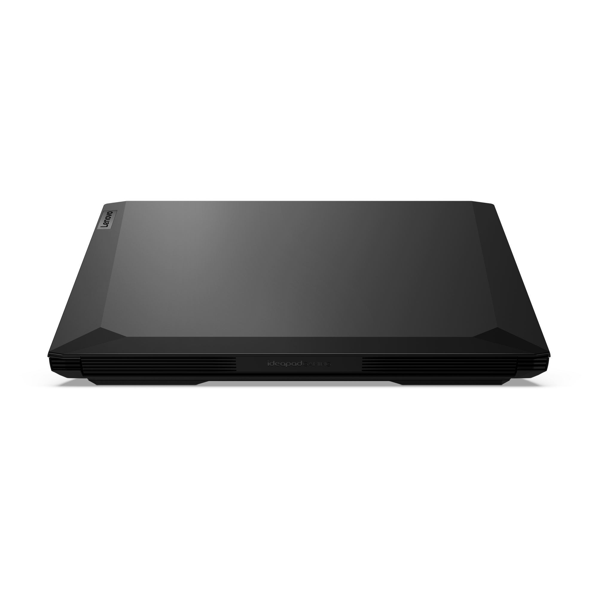 Un portátil Lenovo negro cerrado sobre un fondo negro.