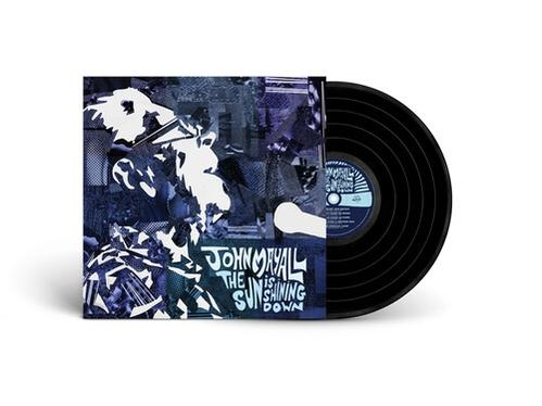 Vinillemez album borítója absztrakt művészettel és egy vinillemez mellette.