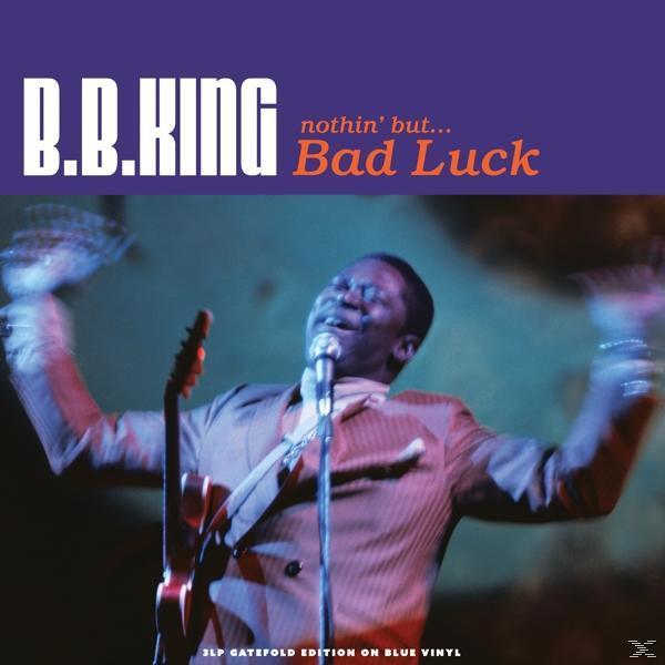 Album borító. B.B. King gitározik és énekel. Szöveg: B.B. King, Bad Luck. Lila és kék háttér.