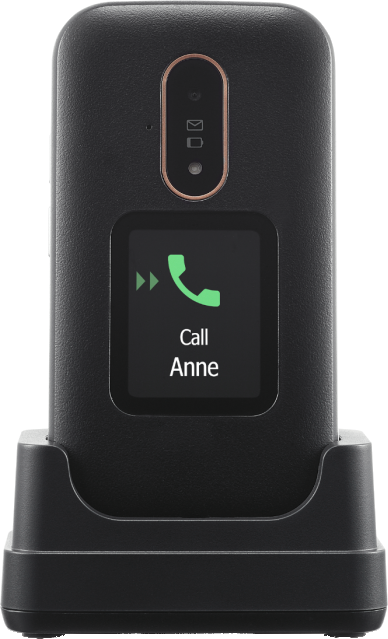 Un téléphone à clapet noir dans son socle de chargement. L'écran affiche 'Appeler Anne' avec une icône de téléphone verte.