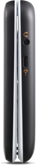 Vue latérale d'un téléphone à clapet noir fermé. Il a des accents blancs au milieu et une prise casque et un port de chargement.