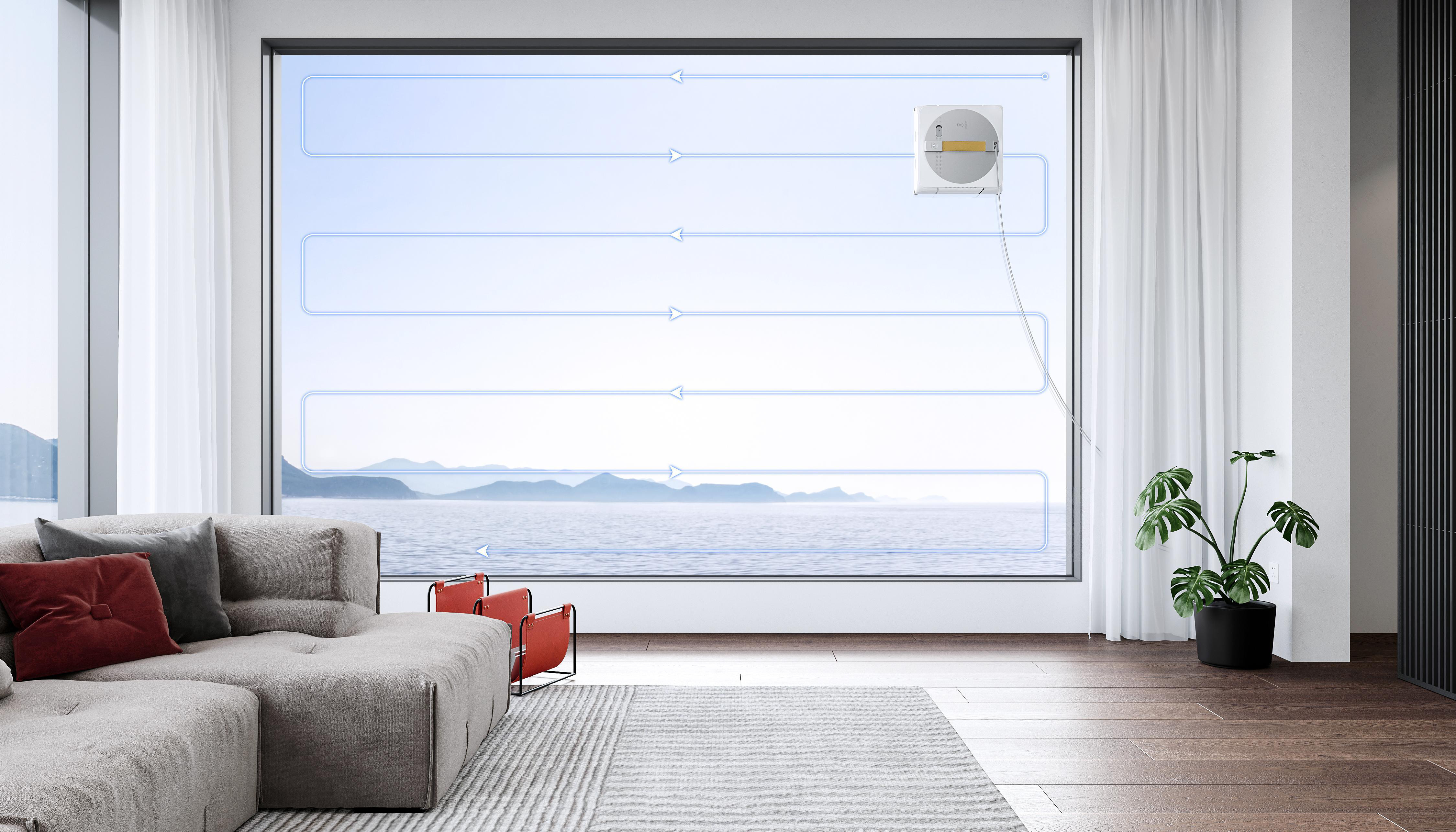 Ein Fensterputzroboter an einem Fenster mit Meerblick. Innen gibt es ein Sofa und eine Pflanze.