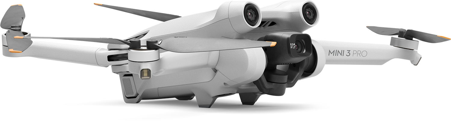 Een witte drone met drie camera's. De drone bevindt zich in de lucht.