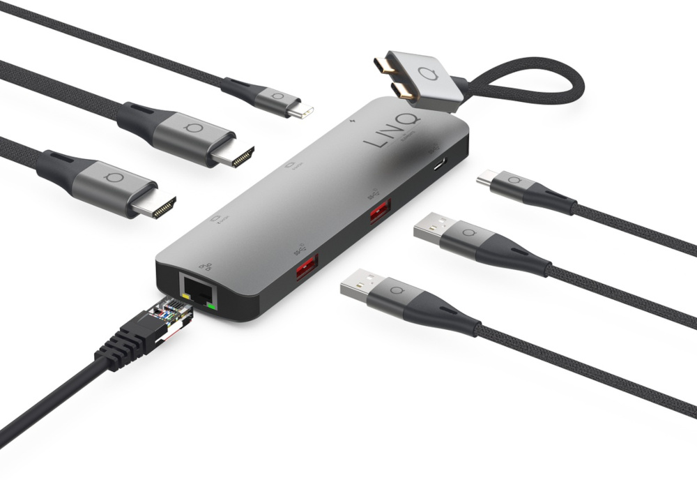 Hub argenté avec plusieurs ports et câbles, dont USB, HDMI et réseau.