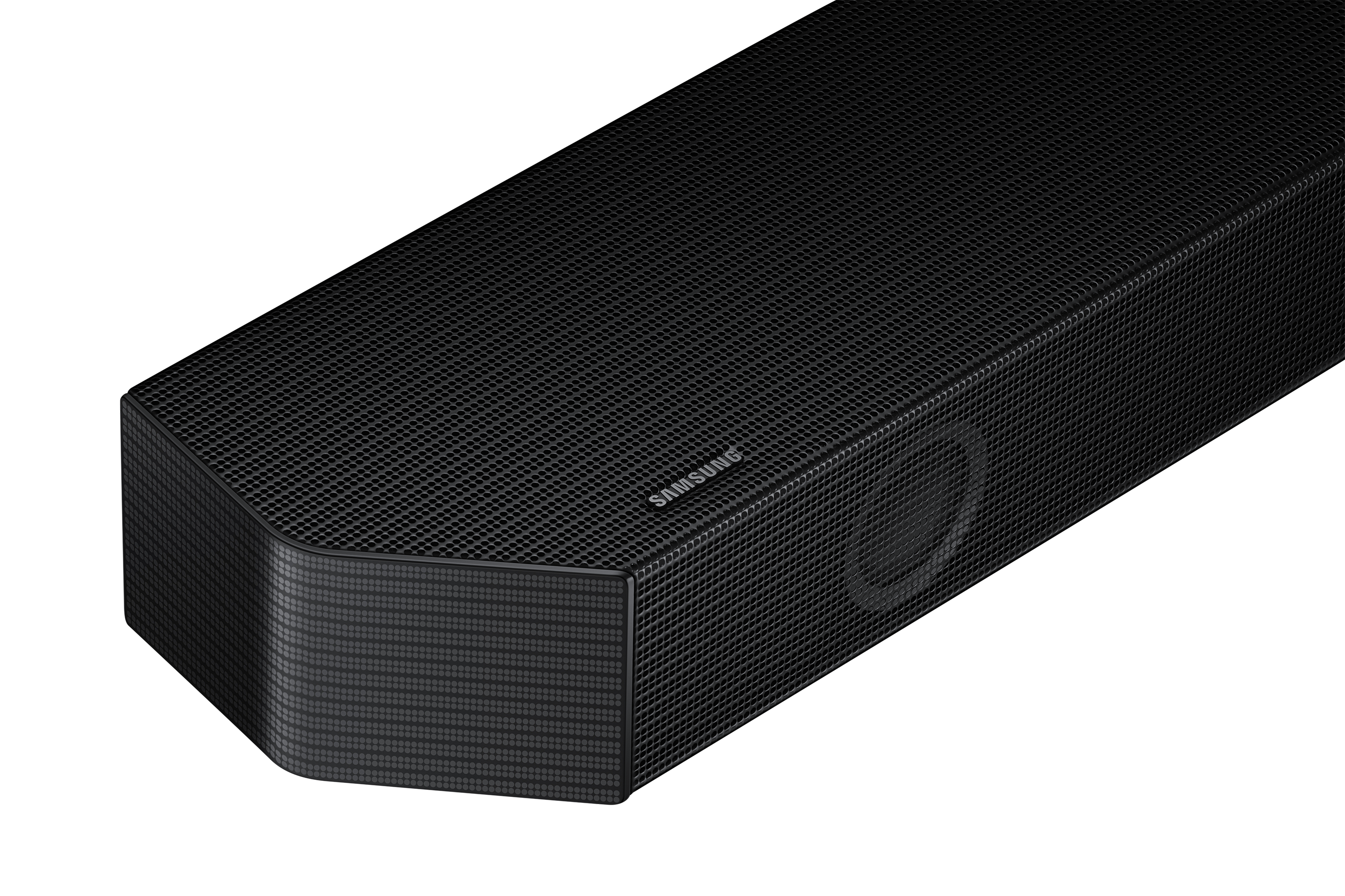 Una barra de sonido negra con una parte frontal de malla y una esquina redondeada. Logotipo SAMSUNG visible.