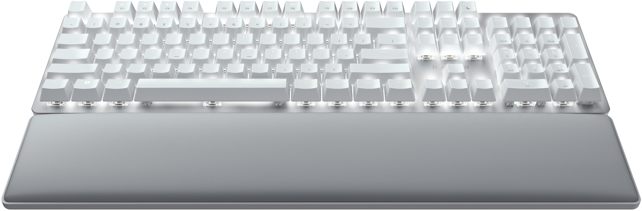 Weiße Tastatur mit Handballenauflage. Die Tasten sind beleuchtet.