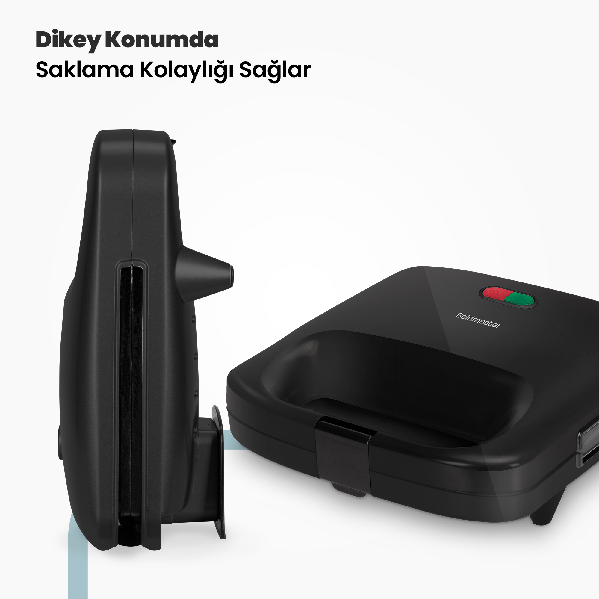 Siyah waffle makinesi. Bir tarafı açık. Diğeri dikey konumda kapalı.