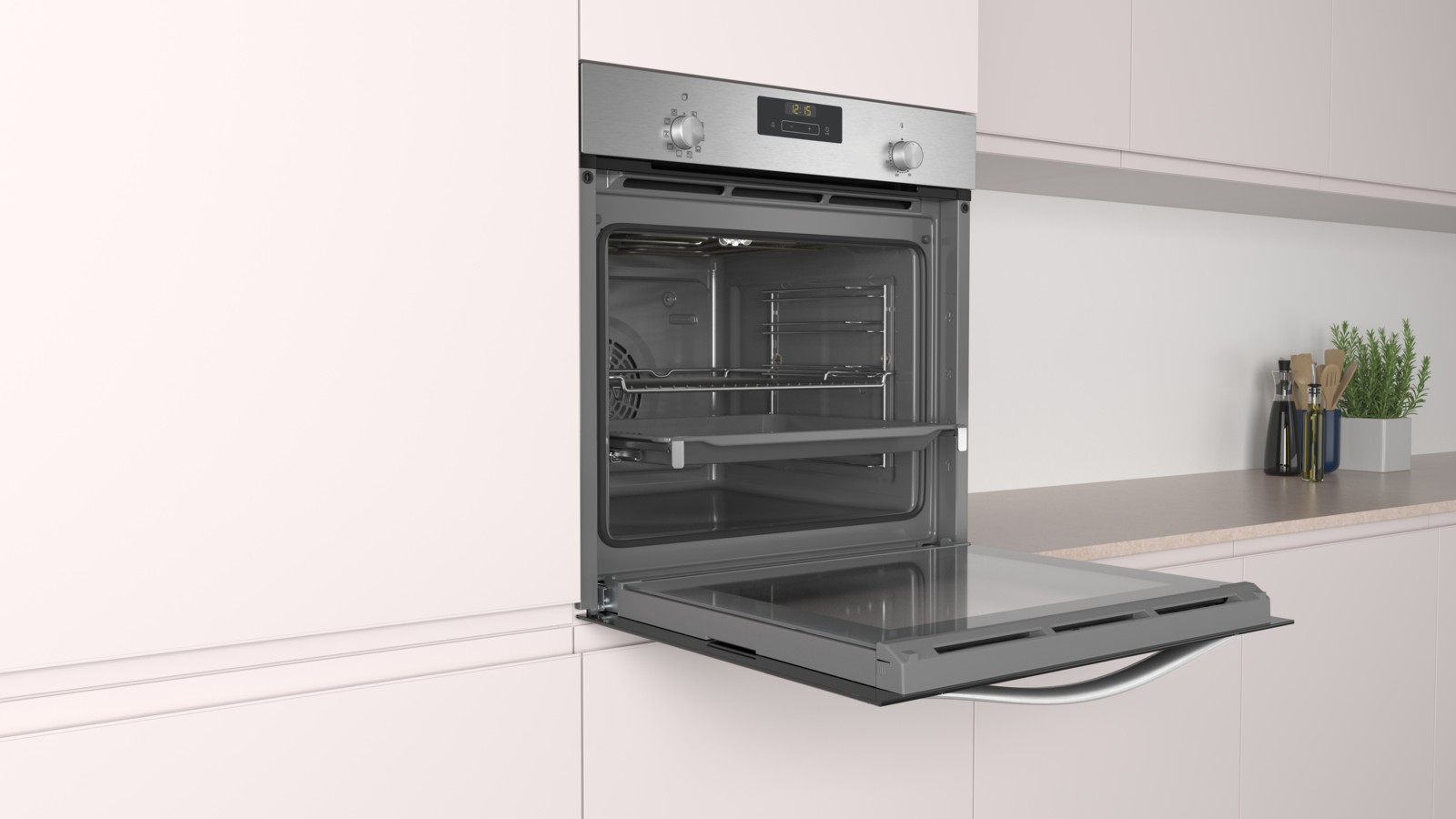 Un horno abierto con puerta de cristal, interior de acero inoxidable. El horno está empotrado en un armario blanco.