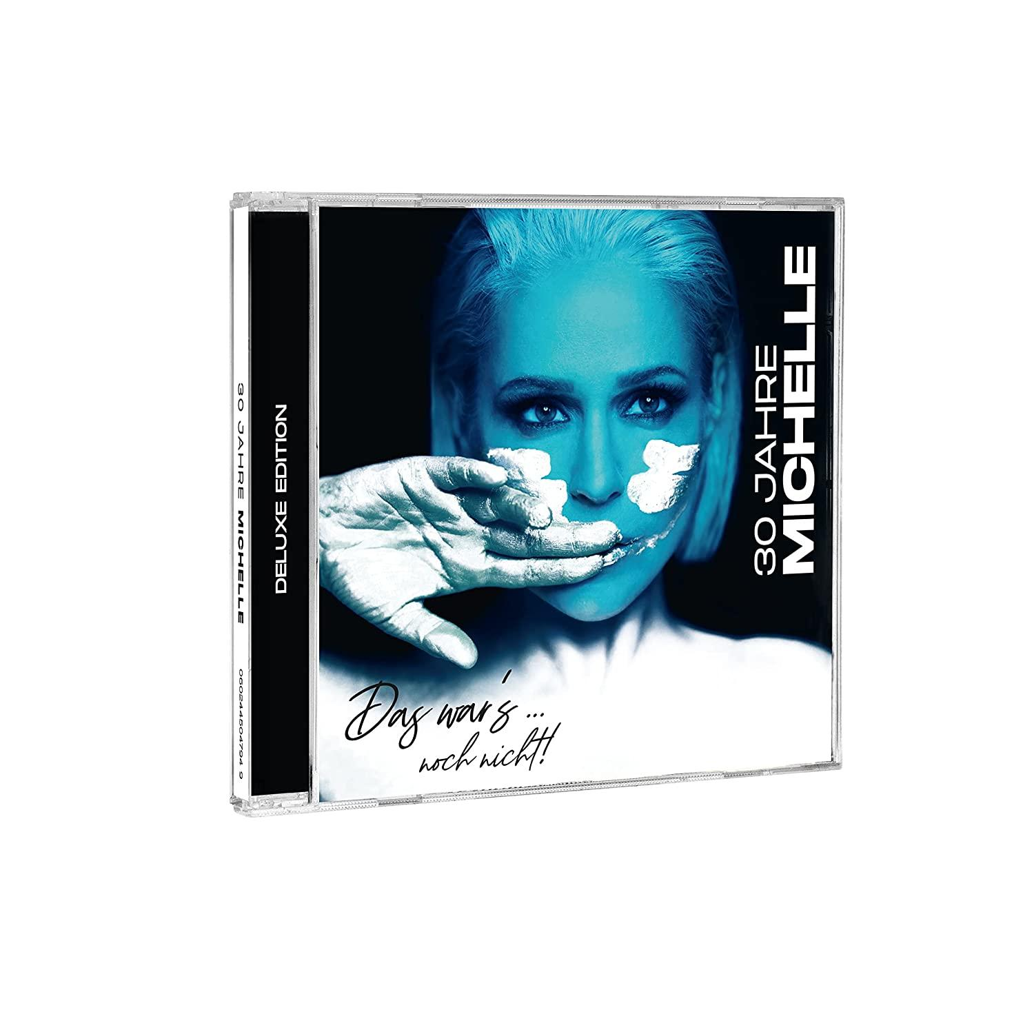 CD-Album mit Michelles Gesicht, bedeckt mit weißer Farbe, auf dunklem Hintergrund.