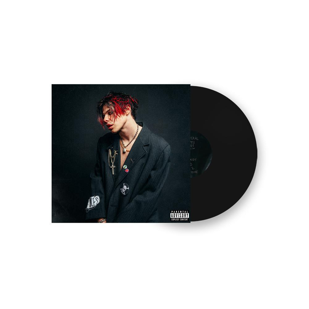 Albumcover mit einem Mann in einem dunklen Blazer. Eine Vinyl-Schallplatte liegt neben dem Cover.