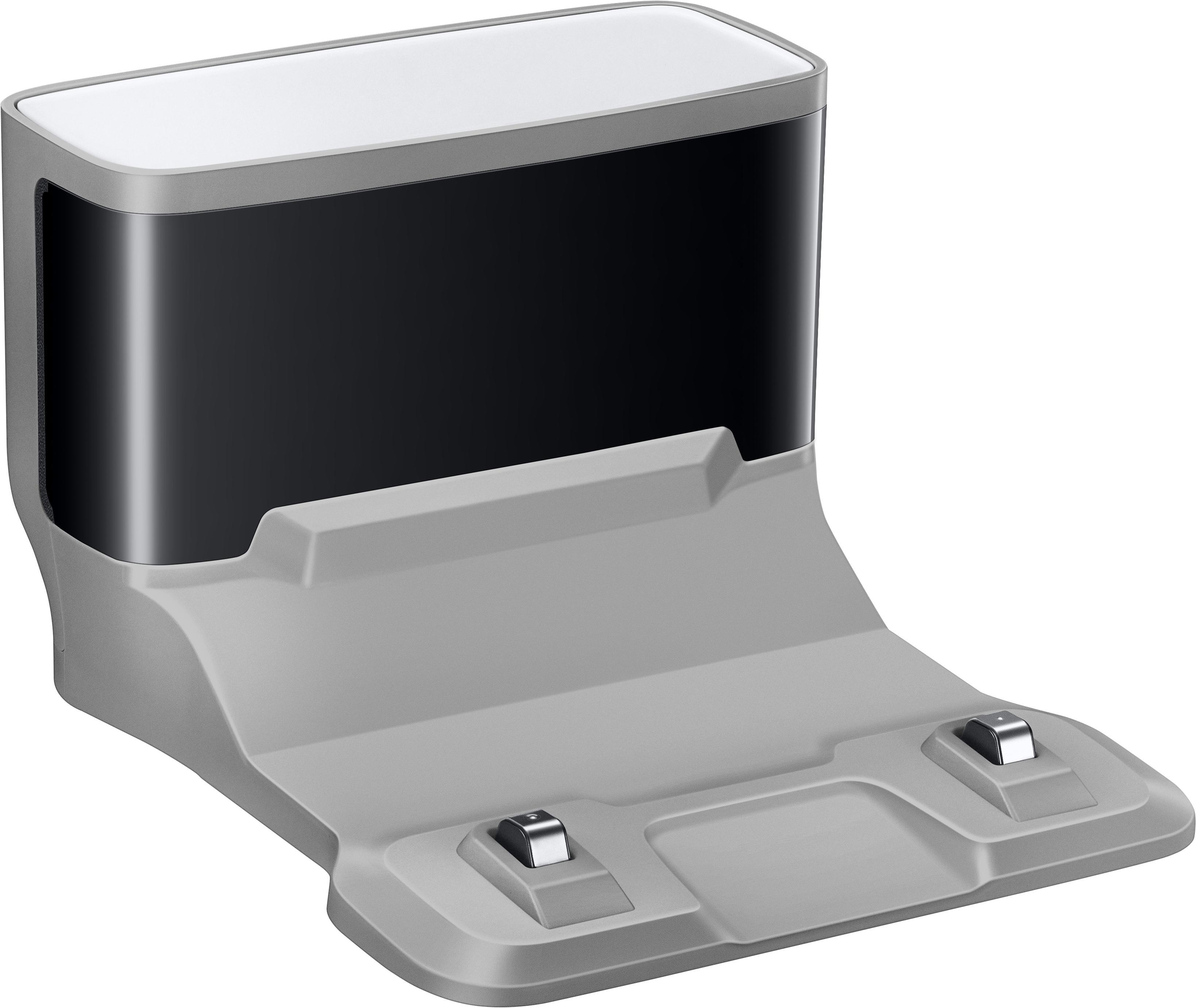 Graue Ladestation für einen Roboterstaubsauger, mit Ladekontakten und schwarzem Deckel.