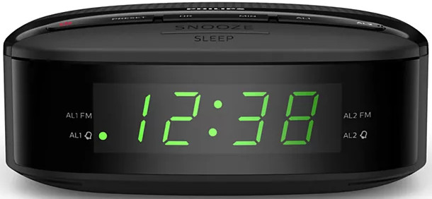 Réveil numérique Philips noir. L'écran vert affiche 12:38. Boutons et détails visibles.
