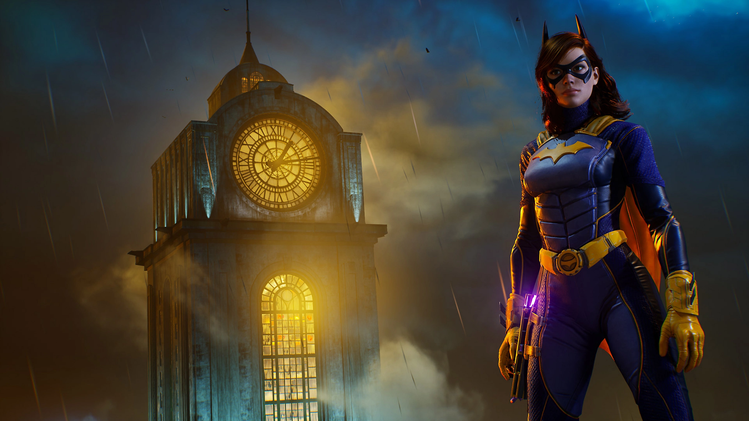 Batgirl im Kostüm steht vor einem Uhrturm in einer regnerischen Nachtszene.