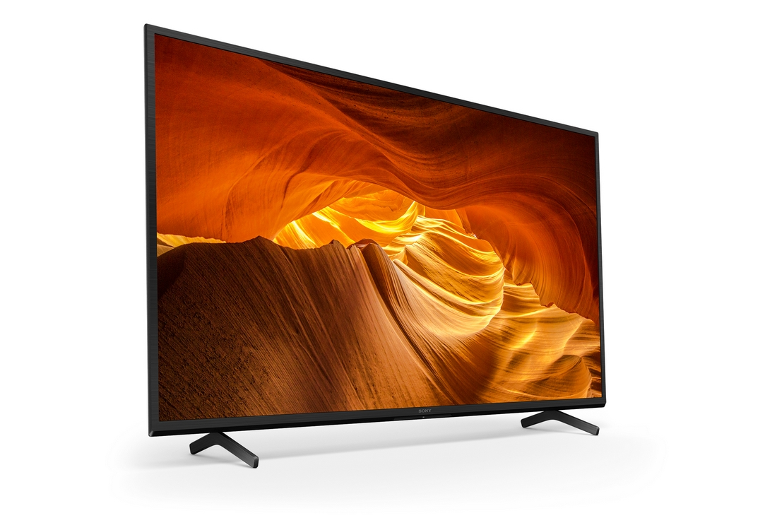 Una pantalla de TV grande que muestra un paisaje de cañón naranja.